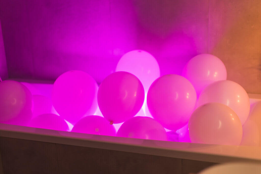 Gel balloons in  bathroom. Neon light