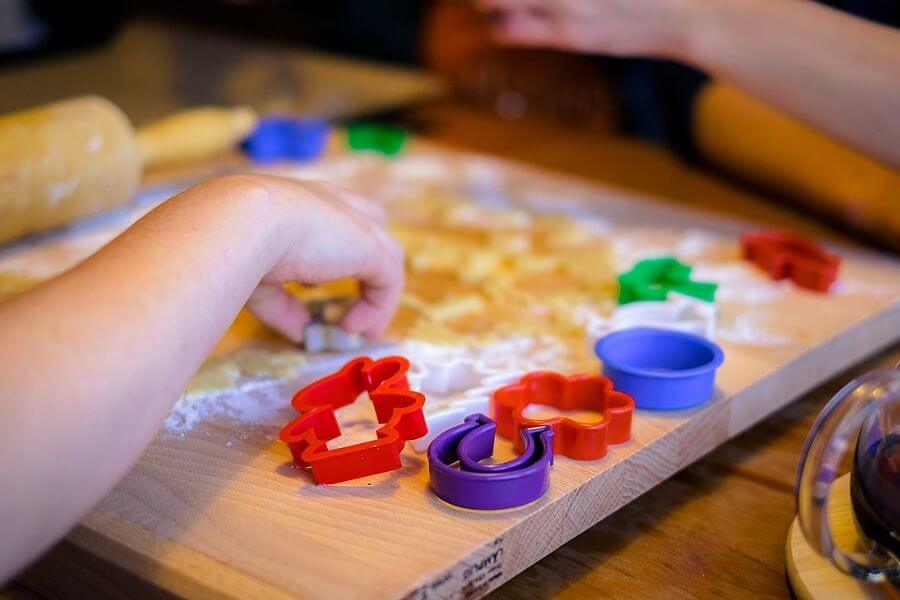 kids hands playing with play dough