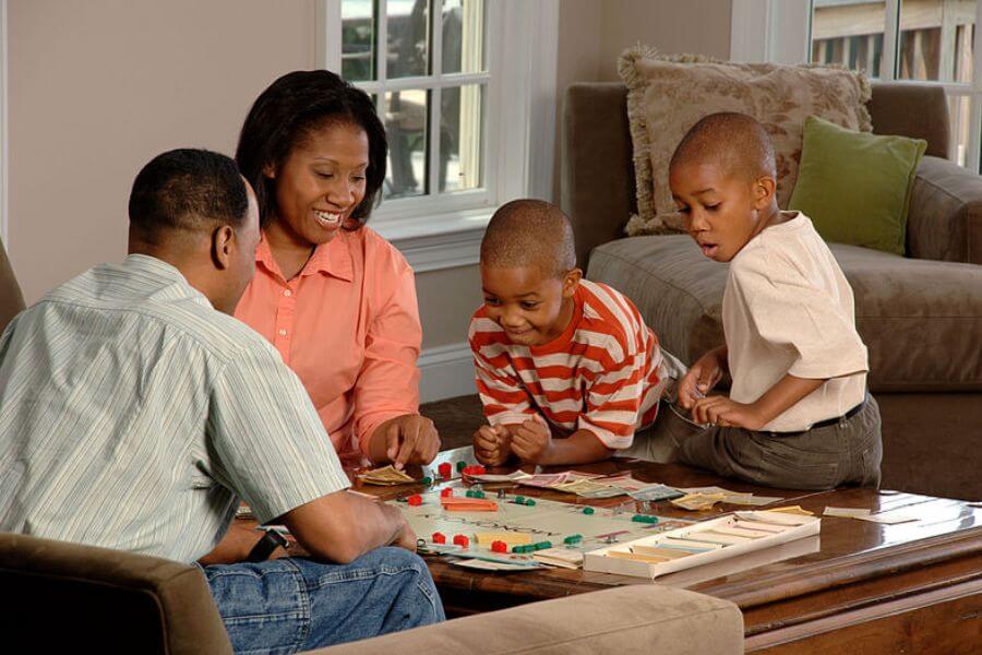 family playing board game